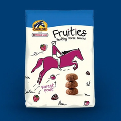 Cavalor FRUITIES healthy horse snacks packaging featuring forest fruit flavor and a rider on a horse.