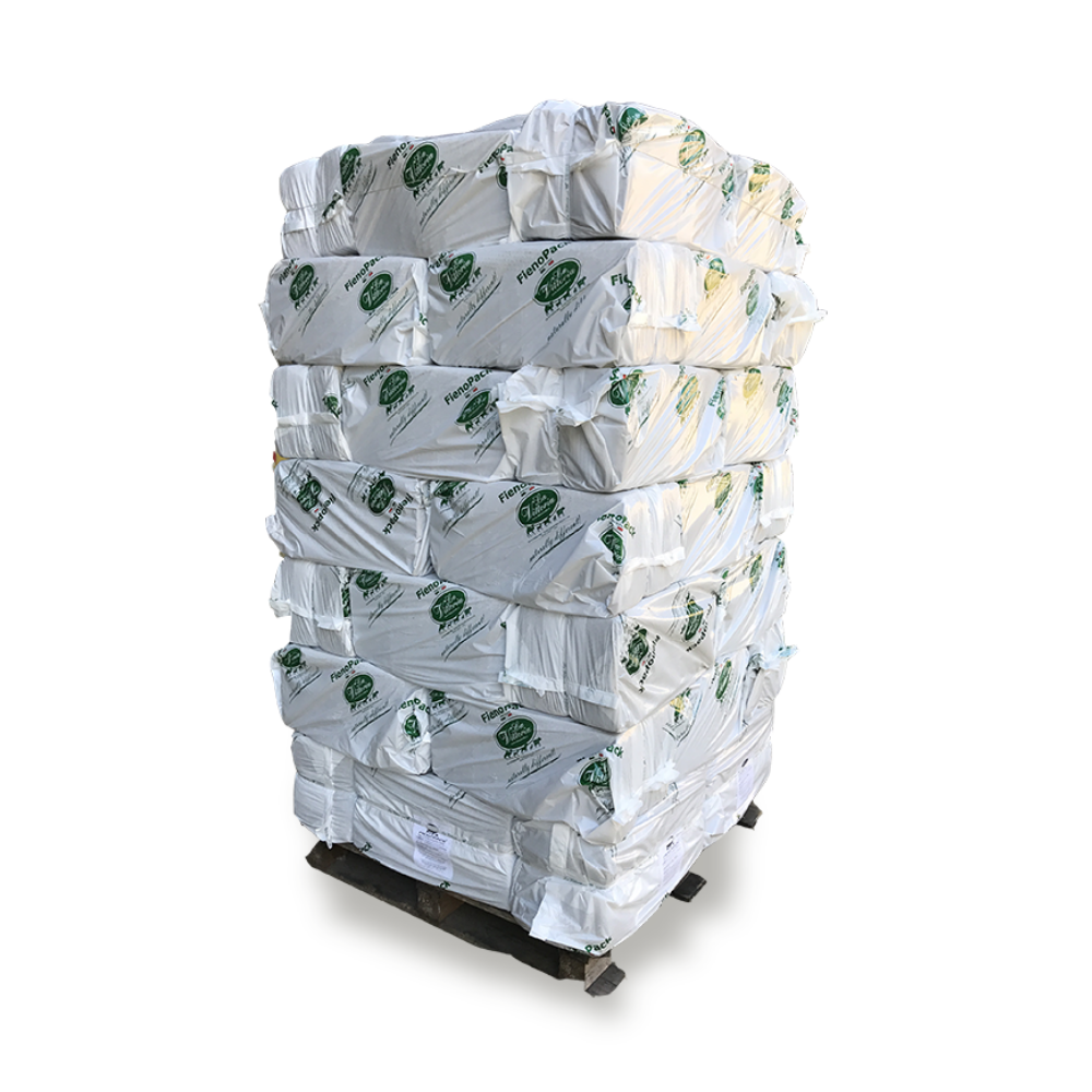 Stacked bales of HAYPACK TIMOTHY hay on a pallet, wrapped in white packaging with green branding.