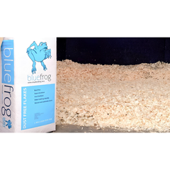 BLUE FROG horse bedding shown with dust-free wood shavings, ideal for healthy stable environments by Boyd Bedding.