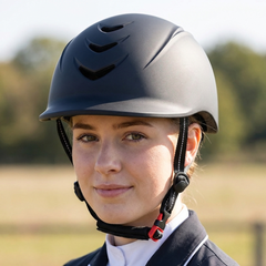 Alzarrab Ucaco AetherLite Plus Riding Helmet worn by a rider in outdoor setting, showcasing its sleek design.