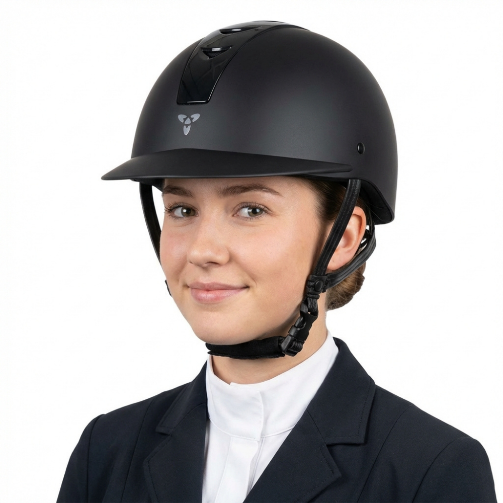 Ucaco Dora Premium Riding Helmet worn by a young woman, showcasing its sleek black design and safety features.