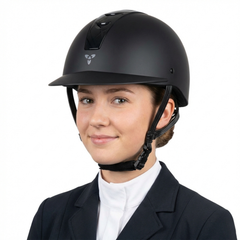 Ucaco Dora Premium Riding Helmet worn by a young woman, showcasing its sleek black design and safety features.