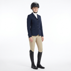 Ucaco Celestia Luxe Riding Helmet worn by a rider in competition outfit, showcasing style and safety in equestrian sport.