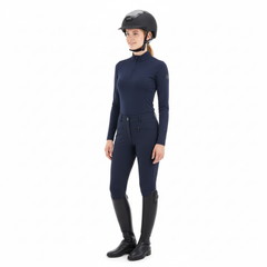 Ucaco Celestia Luxe Riding Helmet worn by a rider in navy equestrian attire, showcasing safety and style.