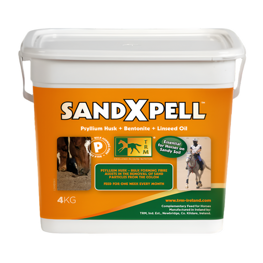 A white bucket of SANDX PELL horse feed with orange and green labeling, featuring images of horses and text detailing the product's use and ingredients.