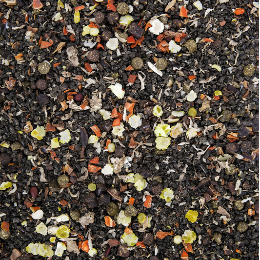 Close-up of herbal muesli blend featuring grains, herbs, and seeds for horse nutrition in PUR.MASH.