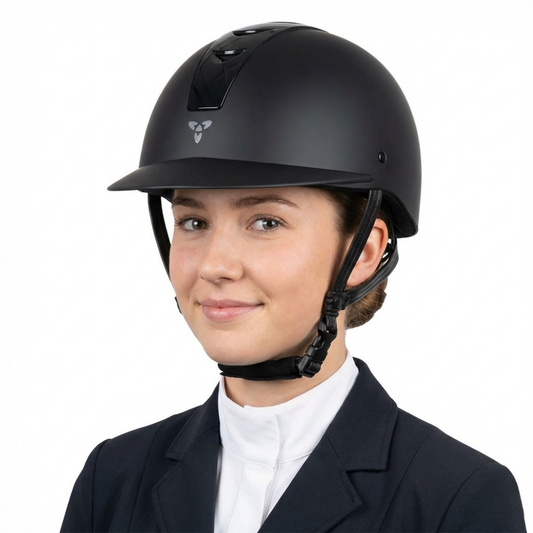 Ucaco Dora Premium Riding Helmet worn by a young woman, showcasing its sleek black design and safety features.