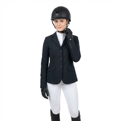 Ucaco Dora Premium Riding Helmet worn by a rider in a stylish equestrian outfit ready for a competition.