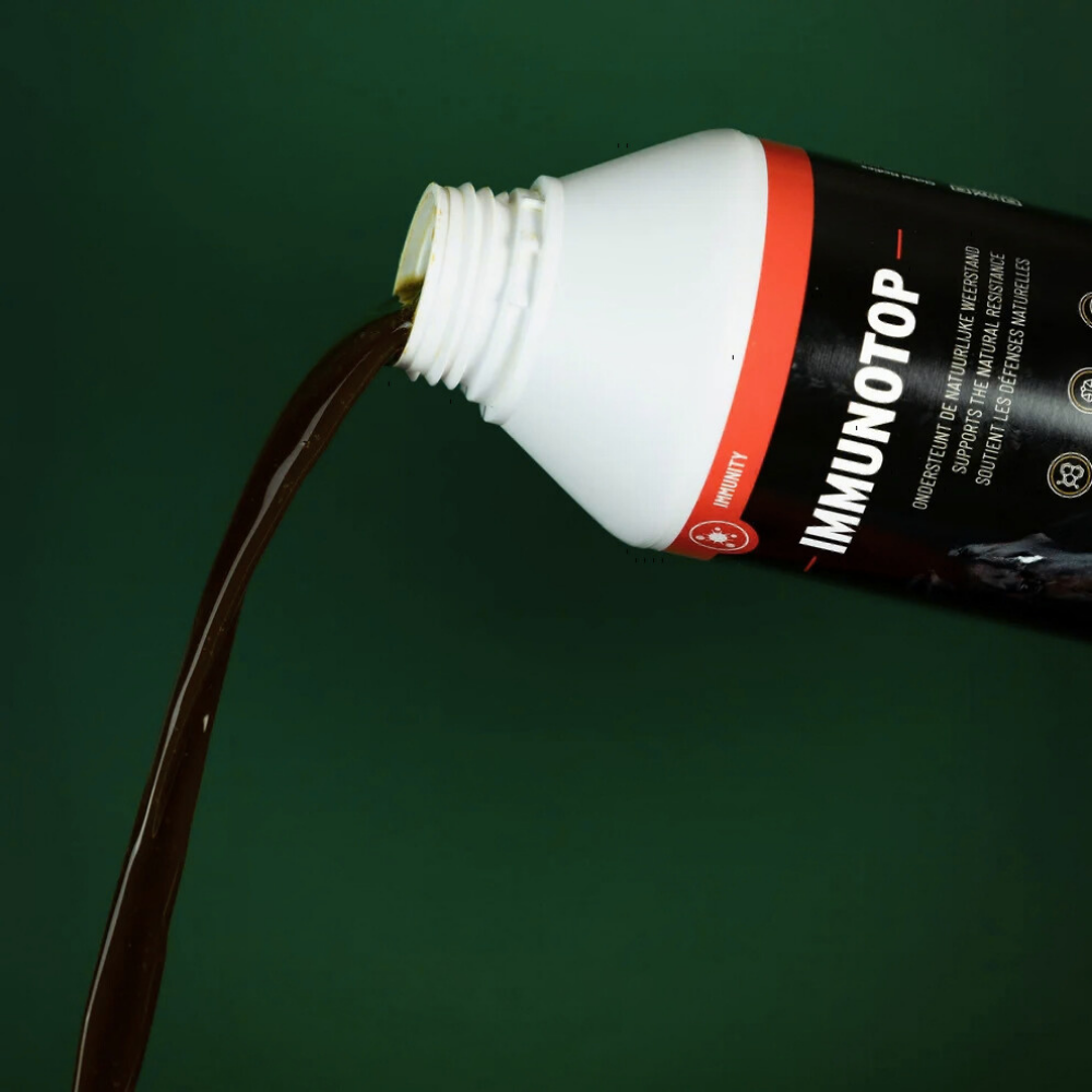 Bottle of Immunotop pouring liquid, showcasing natural immunity support for horses.